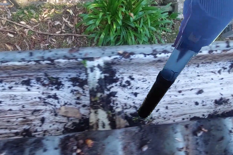 merimbula gutter cleaner employs a blower for effectively removing small debris from the guttering.