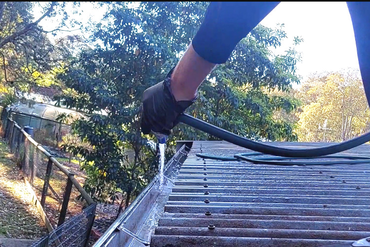 gutter cleaning company in merimbula uses a simple garden hose to deliver stunning results during gutter clean.