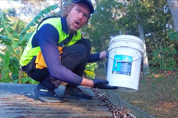 merimbula gutter cleaning is showing the importance of having a bucket during gutter cleaning